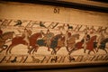 BAYEUX, FRANCE - AUGUST 25, 2022 Detail of the Bayeux Tapestry depicting the Norman invasion of England in the 11th