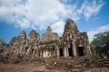 Bayon temple with the four sided face stone sculptures Angkor Thom Cambodia 28 December 2013 Royalty Free Stock Photo