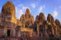 Bayon temple, located in Angkor, Cambodia, the ancient capital city of the Khmer empire. View of the massive stone face towers fro Royalty Free Stock Photo