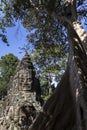 Bayon temple smiling buddha face Angkor Wat Siem Reap Cambodia South East Asia travel Royalty Free Stock Photo