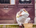 BAYONNE, FRANCE - APRIL 2, 2011: Aged man reading french newspaper