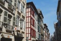 Bayonne, France - April 17, 2022: elegant facades of vibrant colours on the city streets downtown