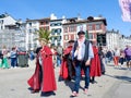 Bayonne, France, April 17, 2022: group of elder people in basque costumes walking on the street during local food festival