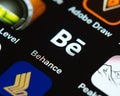 Adobe Behance app icon on Apple iPhone screen