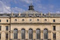 Bayonne, France 19.06.2020 Window, balcony and sculpture on the roof. Old French building, architectural masterpiece Royalty Free Stock Photo