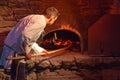 Medieval baker baking the fouaces