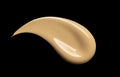 BB, CC cream texture. Nude make up base swatch. Beige skin tone liquid powder foundation smudge isolated on black background