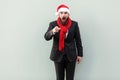 Wow that`s great! Portrait of bearded businessman in christmas