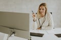 Bbeautiful businesswoman working on laptop in bright modern office Royalty Free Stock Photo