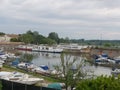 Boats for river tourism docked at the ancient medieval port of Porto Catena