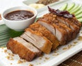 Image of crispy pork served with sauce on a white background. Royalty Free Stock Photo