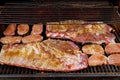 BBQ Baby Back Or Spareribs Ribs Close-up On The Hot Flaming Grill Royalty Free Stock Photo