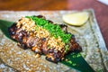 BBQ beef ribs with glazing and peanuts and chopped spring onions