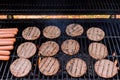 BBQ burgers prepared on a barbecue fire flame grill with beef meat Royalty Free Stock Photo