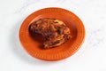 bbq chicken breast piece served in a dish isolated on background side view