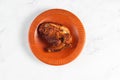 bbq chicken breast piece served in a dish isolated on background side view