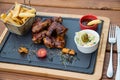 BBQ chicken wings served with Coleslaw salad and french fries Royalty Free Stock Photo