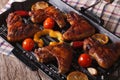 BBQ chicken wings with vegetables in a frying pan grill close-up Royalty Free Stock Photo