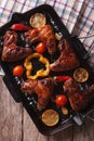 BBQ chicken wings with vegetables in a pan grill close-up. verti Royalty Free Stock Photo