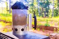 A BBQ chimney starter is used to get charcoal ready for grill so that it is glowing hot when you turn it on Royalty Free Stock Photo