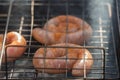 BBQ with fiery sausages on the grill