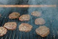 On the bbq fire flame grill prepared and cooked grilled beef meat barbecue burgers for hamburgers Royalty Free Stock Photo
