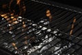 BBQ fire and grill with flames close up before cooking on charcoal Royalty Free Stock Photo