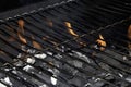 BBQ fire and grill with flames close up before cooking on charcoal Royalty Free Stock Photo