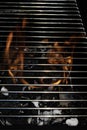 BBQ fire and grill with flames close up before cooking on charcoal Royalty Free Stock Photo