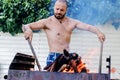 The BBQ fire starter master. Royalty Free Stock Photo