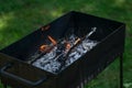 BBQ grill with burning wood with flames and glowing red coal Royalty Free Stock Photo