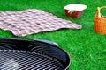 BBQ Grill,Picnic Basket With Wine, Blanket On The Lawn Royalty Free Stock Photo