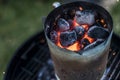 BBQ Grill Pit Glowing And Flaming Hot Charcoal Briquettes coal Food Background Or Texture Close-Up Top View Royalty Free Stock Photo