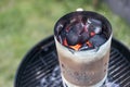 BBQ Grill Pit Glowing And Flaming Hot Charcoal Briquettes coal Food Background Or Texture Close-Up Top View Royalty Free Stock Photo