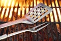 BBQ Grill Tools On The Hot Flaming Cast Iron Grate