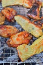 BBQ chicken wings fish roll fire charcoal Royalty Free Stock Photo