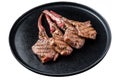 BBQ Grilled lamb chops steaks in a plate. Isolated on white background, top view. Royalty Free Stock Photo