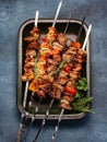 Bbq grilled meat pork, chicken and vegetable skewers on tray. Top view, flat lay Royalty Free Stock Photo