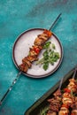 Bbq grilled meat pork and vegetable skewers on gray plate . Top view, flat lay Royalty Free Stock Photo