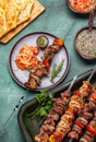Bbq grilled meat pork and vegetable skewers on gray plate . Top view, flat lay, gray background Royalty Free Stock Photo