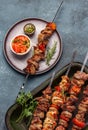 Bbq grilled meat pork and vegetable skewers on gray plate . Top view, flat lay, gray background Royalty Free Stock Photo