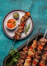 Bbq grilled meat pork and vegetable skewers on gray plate . Top view, flat lay Royalty Free Stock Photo