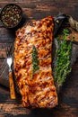 BBQ grilled pork spare ribs on a cutting board. Wooden background. Top view Royalty Free Stock Photo