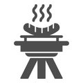 BBQ and grilled sausages solid icon, picnic concept, barbecue with hot sausages sign on white background, bbq grill icon Royalty Free Stock Photo