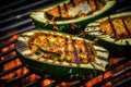Bbq, grilled stuffed zucchinis on grill grate with fire. Close-up view. Summer picnic outdoors.