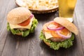 bbq hamburger with french fries and beer on the wooden background. Royalty Free Stock Photo