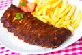 BBQ marinated spareribs and fries Royalty Free Stock Photo