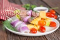 Bbq meat on sticks, kebab skewers with sauce, on wooden background. Traditional barbecue grill food. Royalty Free Stock Photo