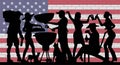 BBQ Party Silhouette in front of Brick Wall with USA Flag Royalty Free Stock Photo