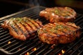 bbq pork chops with herbs and spices on grill grate Royalty Free Stock Photo